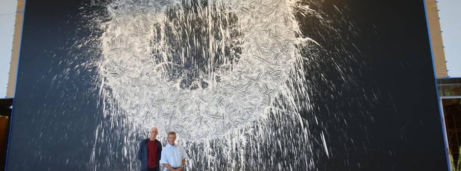 Richard Long and Craig Hall standing in front of 'Dallas Rag' painting