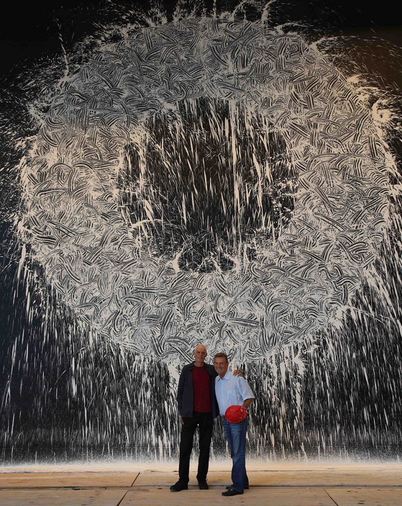 Richard Long and Craig hall standing in front of the 'Dallas Rag' painting in KPMG Plaza lobby.
